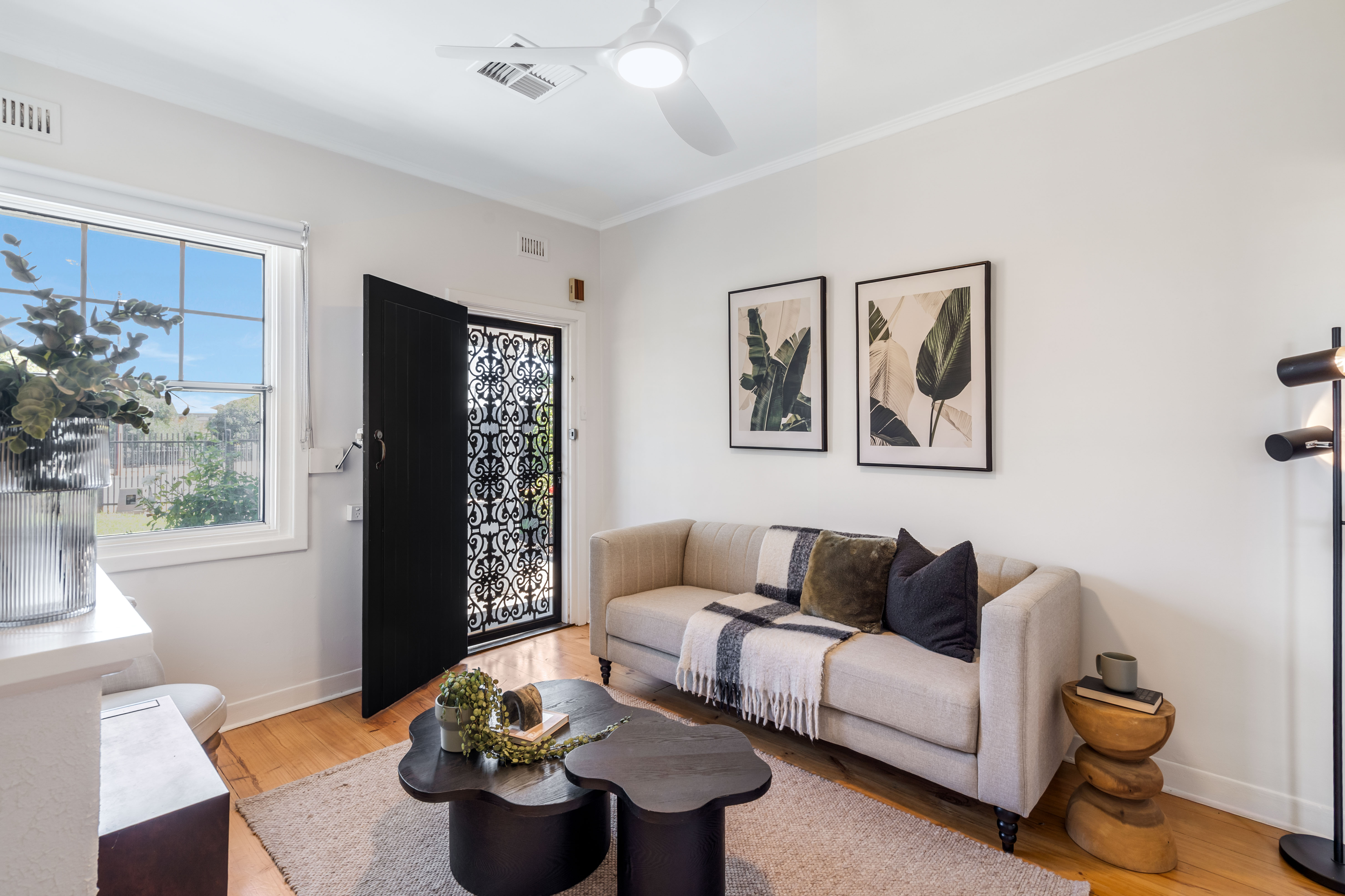 Living room with feature door and sofa